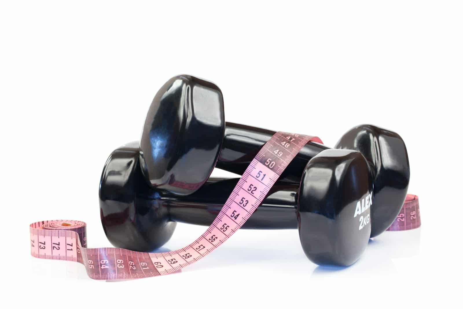 a pair of dumbs with a measuring tape around them